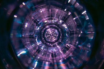 Photo of a glass from an interesting angle, futuristic lighting. Glass reflections on the lens, spectrum colors, rainbows, optical effect