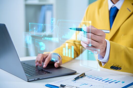Business professional analyzing financial data with digital charts on a laptop
