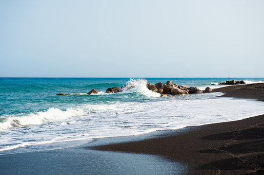 Santorini island, Greece. Perissa beach with black volcanic sand.