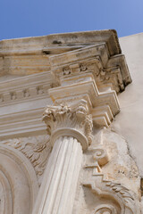 Ornate Stone Column with Classical Details on Historic Building