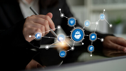 Professional hand engaging with digital interface showing networks, connections, and symbols representing business collaboration, partnerships, and technology concepts. Tessel.