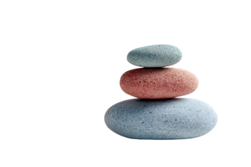 Three smooth, colorful stones balanced atop each other, creating a simple, serene stack