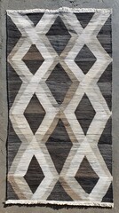 Textured diamond pattern rug with abstract black white and brown coloration for home decor