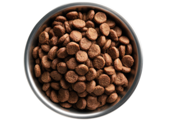 Top-down view of dog food pellets in a metal bowl.  Small, round, light brown kibble fills a shallow, round metal bowl