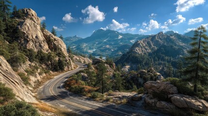 A highway passing through mountains with rocky peaks and greenery under a clear blue sky.