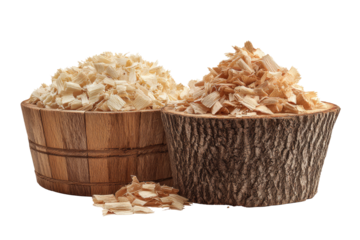 Two wooden bowls filled with wood shavings, one light, one darker