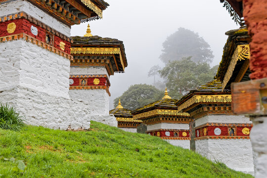 DOCHULA, BHUTAN, OCtober 4, 2025 : On a mountain pass in the Himalayas on the road from Thimphu to Punakha, 108 memorial stupas known as Druk Wangyal Chortens have been built