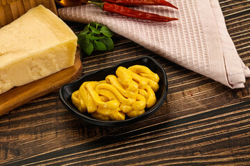 Yellow cheese sauce in the bowl