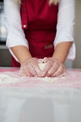 Making a cake with white and pink chocolate strawberries. High quality photo