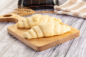 Raw uncooked croissant for bake