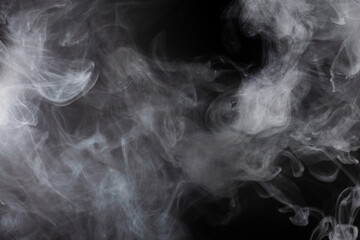 White steam on a black background.