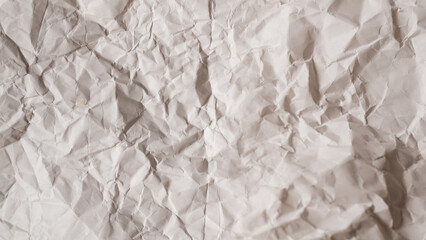 Crumpled white paper background.