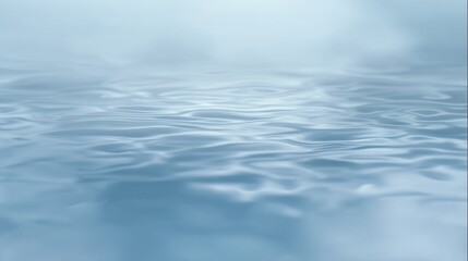 A serene, light blue water surface with gentle ripples and reflections. This tranquil image creates a peaceful and calming atmosphere.