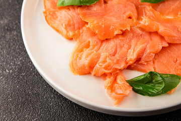 Smoked salmon fish seafood portion size natural product tasty snack fresh delicious gourmet food background on the table rustic top view copy space pescetarian diet