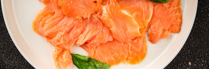 Smoked salmon fish seafood portion size natural product tasty snack fresh delicious gourmet food background on the table rustic top view copy space pescetarian diet