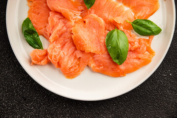Smoked salmon fish seafood portion size natural product tasty snack fresh delicious gourmet food background on the table rustic top view copy space pescetarian diet