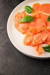 Smoked salmon fish seafood portion size natural product tasty snack fresh delicious gourmet food background on the table rustic top view copy space pescetarian diet