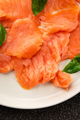 Smoked salmon fish seafood portion size natural product tasty snack fresh delicious gourmet food background on the table rustic top view copy space pescetarian diet
