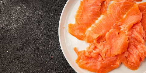 Smoked salmon fish seafood portion size natural product tasty snack fresh delicious gourmet food background on the table rustic top view copy space pescetarian diet