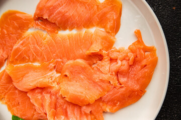Smoked salmon fish seafood portion size natural product tasty snack fresh delicious gourmet food background on the table rustic top view copy space pescetarian diet