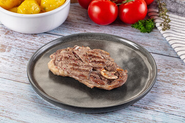 Grilled lamb steak with bone