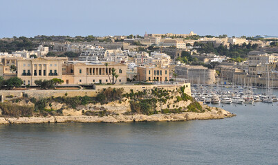 The historic Bighi Complex in Kalkara, Malta, featuring imposing architecture and coastal views along Triq Marina. Cultural heritage of Malta