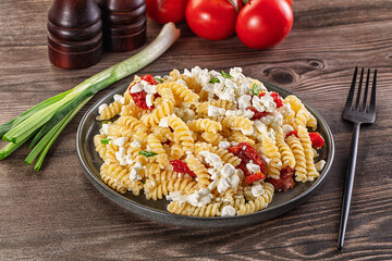 Italian pasta fusili with curd