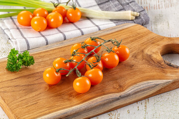 Ripe juicy yellow cherry tomatoes