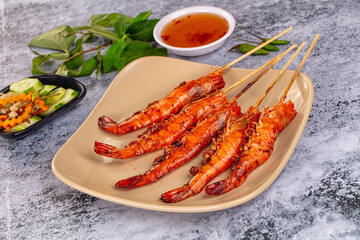 Grilled prawn skewer served sauce