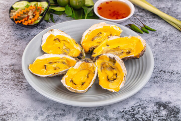 Baked oyster with cheddar cheese