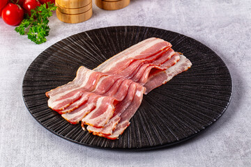 Raw bacon pork meat slices
