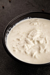Stracciatella cheese soft young portion size Italian food natural product tasty snack fresh delicious gourmet food background on the table rustic top view copy space