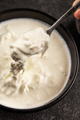 Stracciatella cheese soft young portion size Italian food natural product tasty snack fresh delicious gourmet food background on the table rustic top view copy space