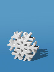 Three Dimensinoal Snowflake Ornament on a Light Blue Background