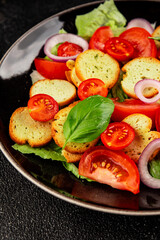 Panzanella salad tomato, croutons, onions vegetables dish natural product tasty snack fresh delicious gourmet food background on the table rustic top view copy space