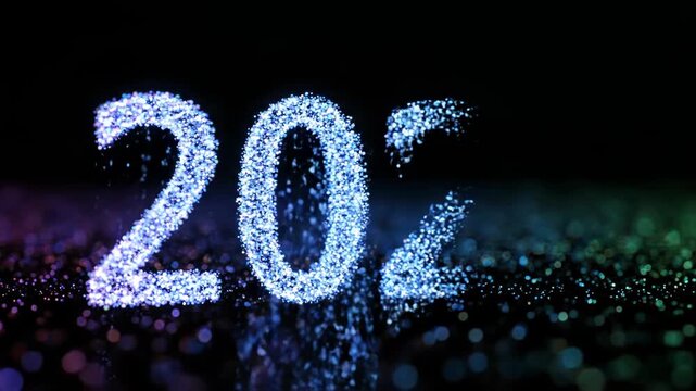 Year two zero twenty six made of blue glitter particles on black background for calendar or event planning