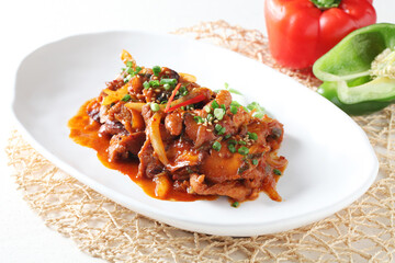 A Korean-style stir-fried pork dish made with shiitake mushrooms and sweet soy marinade, offering a tender and savory flavor. Created by Master Chef Hanshunseop. Photographed in Korea.