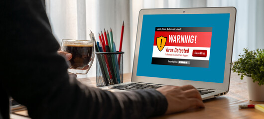 Virus warning alert on computer screen detected modish cyber threat , hacker, computer virus and...
