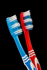 Toothbrushes isolated on black background.