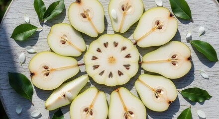 Freshly Sliced Fruits Arranged on a Table with Leaves and White Petals In a Circle