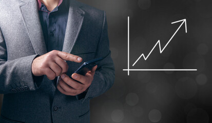 hand holding a chart with an arrow pointing up