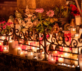 Grave candles and  lanterns at cemetery during the All Saints' Day. Death candles and  lanterns lit in cemetery.
