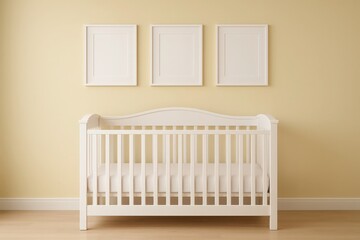 Empty crib with three blank picture frames on wall