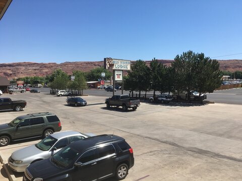 Moab, UT, USA - 6 July 2018: Parking lot of the Big Horn Lodge, a roadside hotel on Main Street in Moab, Utah's top tourist destination for outdoor sports and national parks.