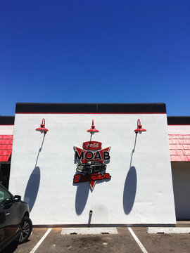 Moab, UT, USA - 6 July 2018: View of the eExterior of the Moab Diner on Main Street from the parking lot with deep blue sky.  Summertime in Utah's popular tourist destination town of Moab.