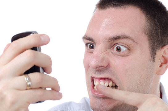 Angry man yelling at phone