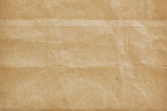 textured kraft paper background with natural creases and folds. Perfect for vintage, rustic, or craft-themed design projects needing an earthy parchment look