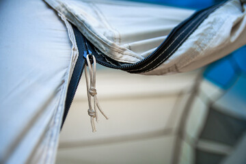 Close-Up of Tent Zipper Outdoors. Camping Gear Detail.