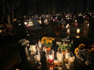 Traditional Polish cemetery on All Saints&rsquo; Day, glowing with countless candles at night. A moving cultural and spiritual tradition captured in vivid light and color.