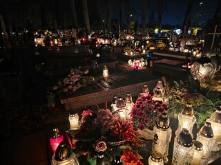 Traditional Polish cemetery on All Saints&rsquo; Day, glowing with countless candles at night. A moving cultural and spiritual tradition captured in vivid light and color.